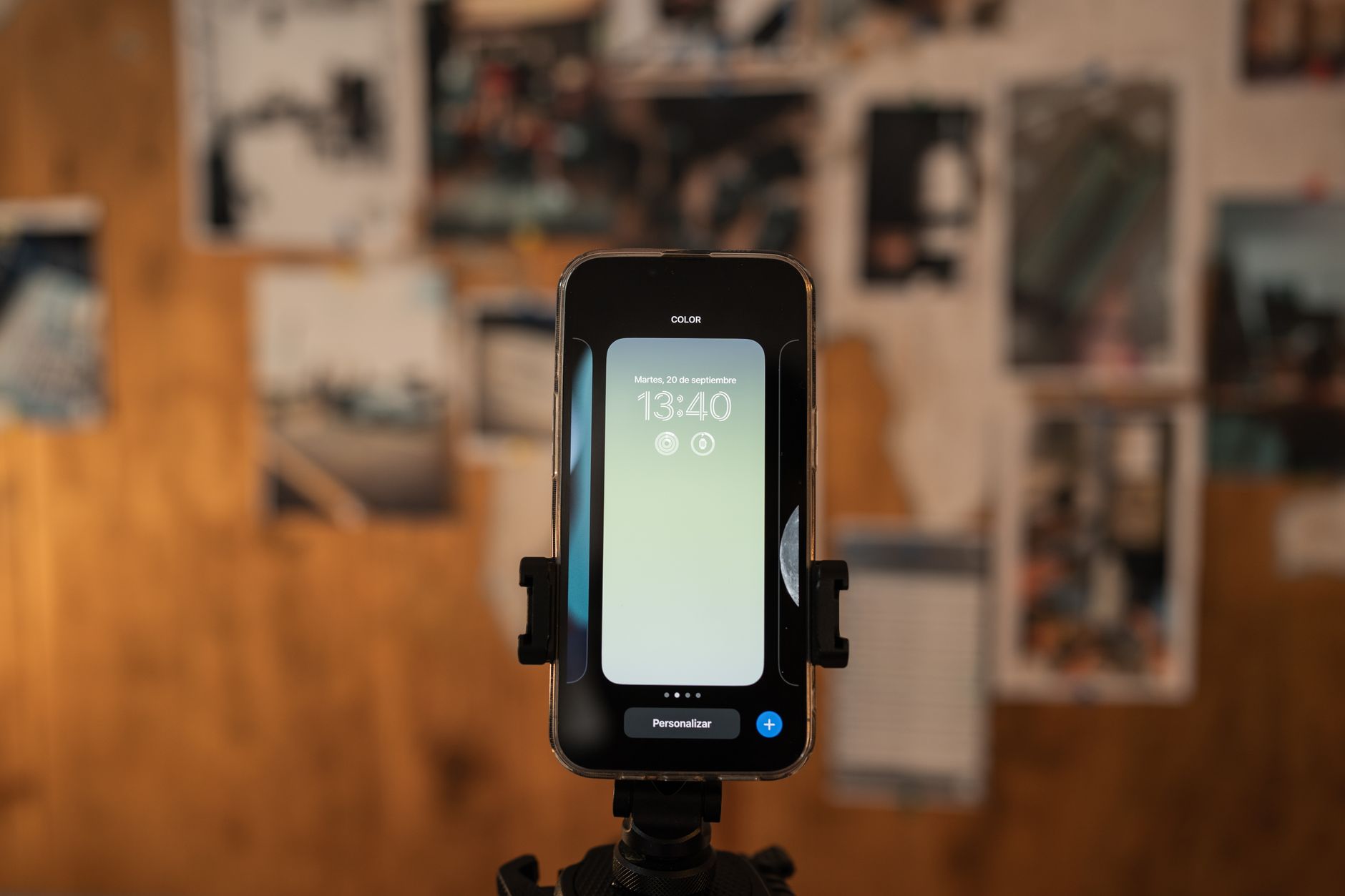 Phone on tripod set up to record in a home office