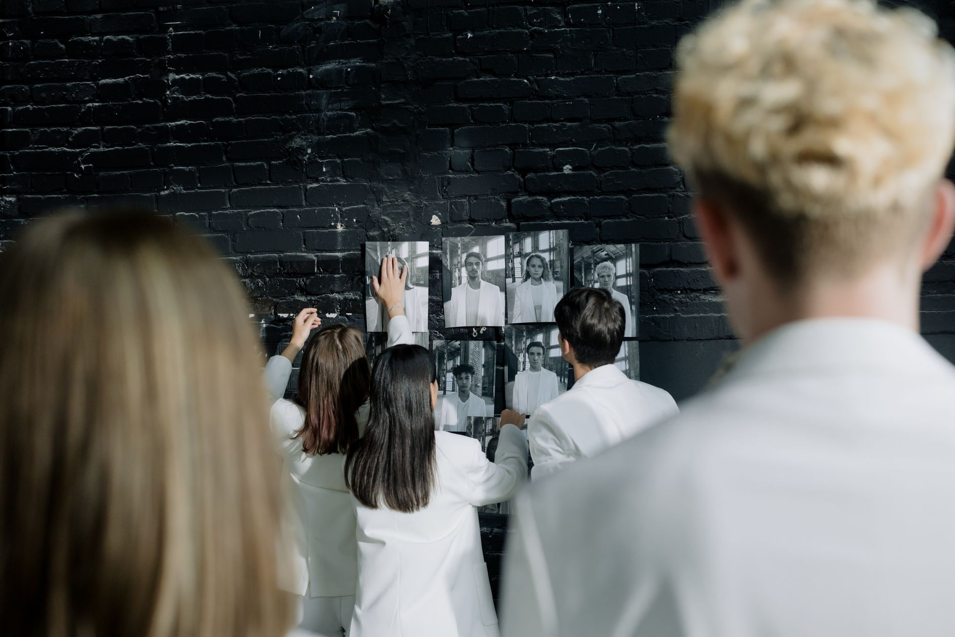 Pinboard covered with printed video stills